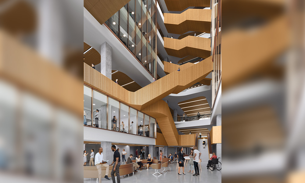 A rendering of the inside of the School of Business building, with students milling about on the main level and massive staircases behind them in the atrium.