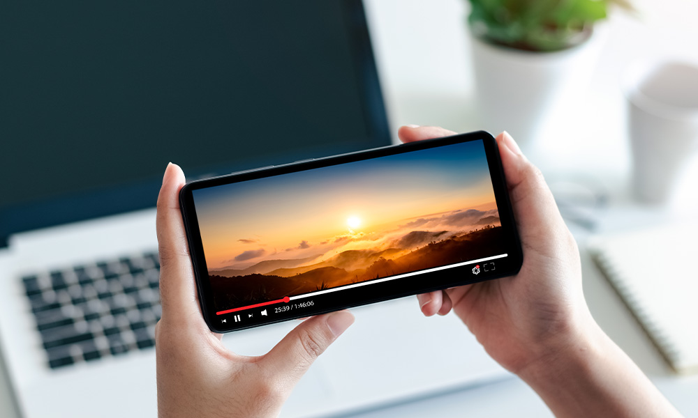 A sunset seen on a smartphone screen.