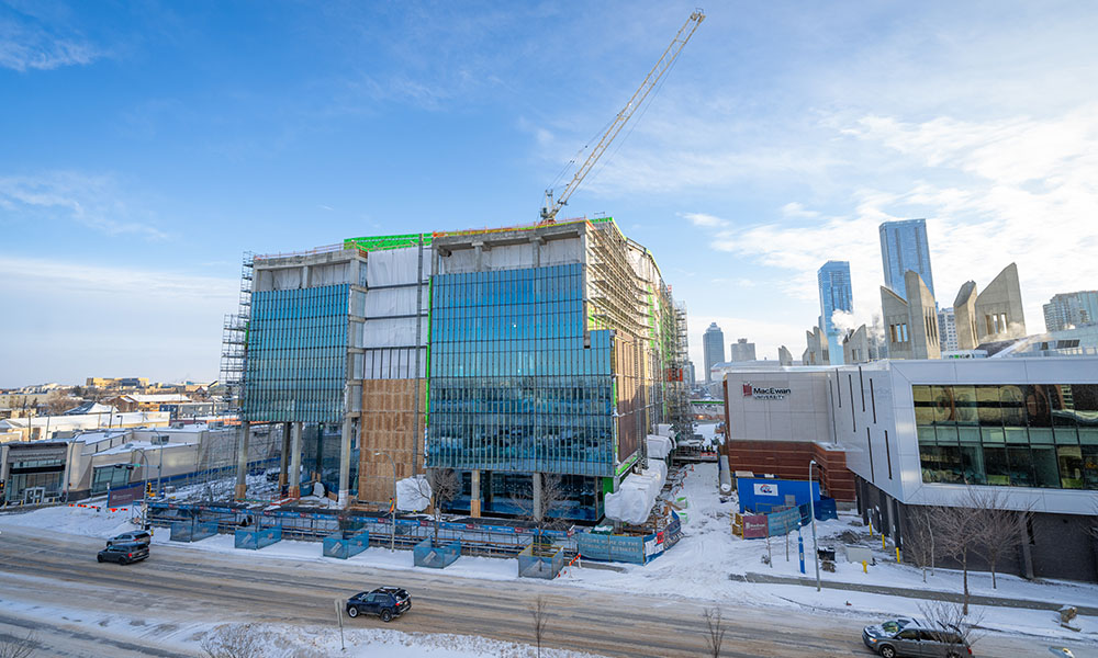 The outside of the building that now has windows installed, although not many exterior walls yet