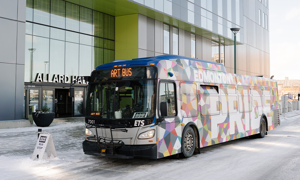 An ETS bus sits outside of Allard Hall, with Art Bus as its posted route.