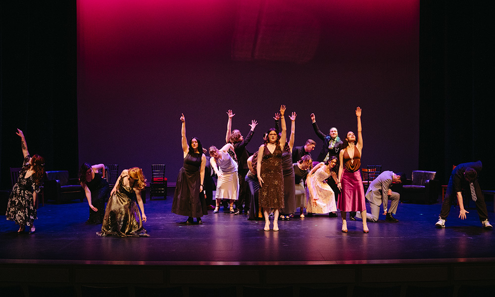 Students on stage in the Triffo are photographed in mid-dance.