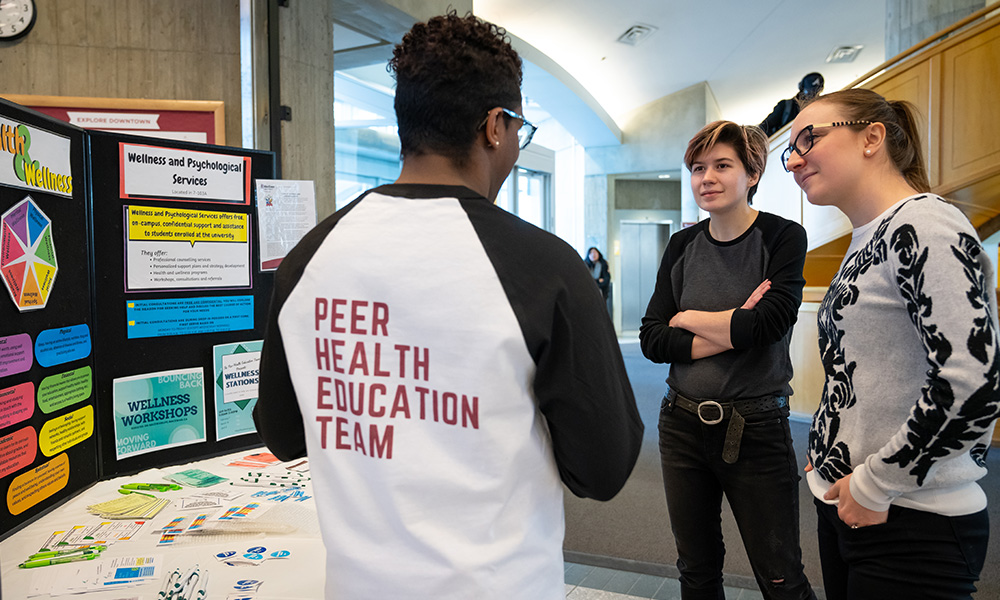 group of students standing around talking