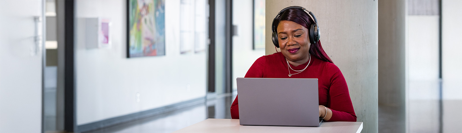 woman using a laptop at table