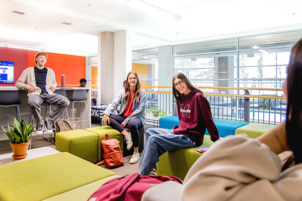students sitting on couches at MacEwan University residences