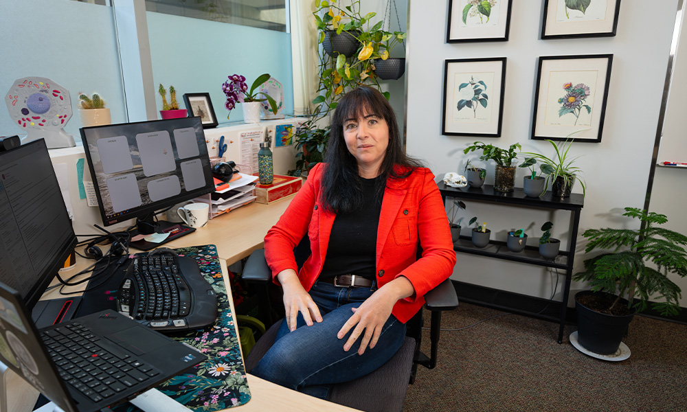 Melissa Hills sits in her office