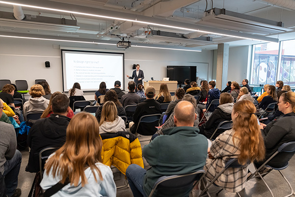 instructor presentation in front of potential students and their parents