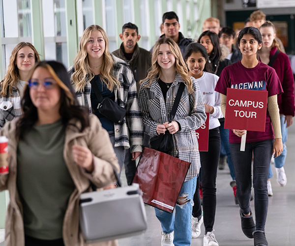 students walking in the hallway for a campus tour