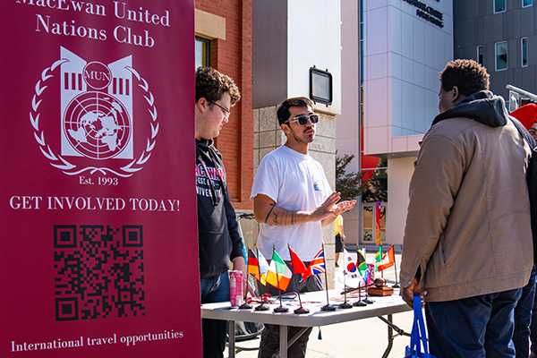 student at united nations club booth