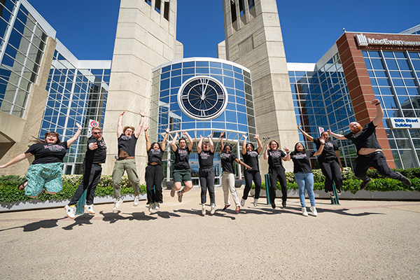 group of students jumping into the air