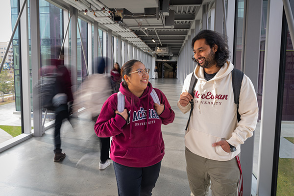 students walking down stairs in front of SAMU building
