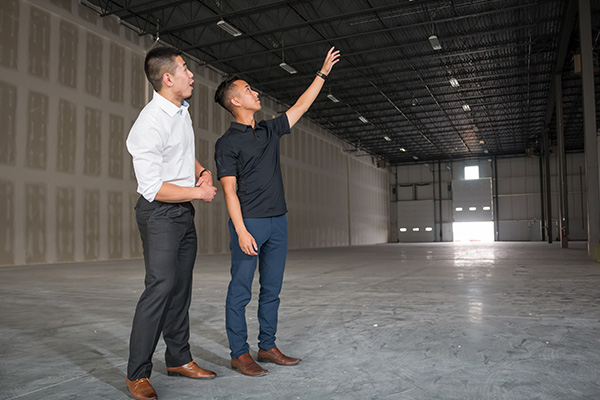 close up of people in laboratory looking at petri dish