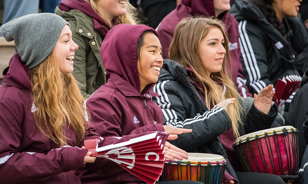 students in stands cheering